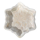 Snowflake dough bowl, empty, showing the design CNC-carved into the bottom